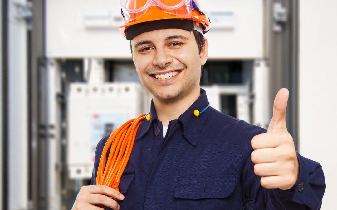 Man Wearing A Hard Hat And Smiling