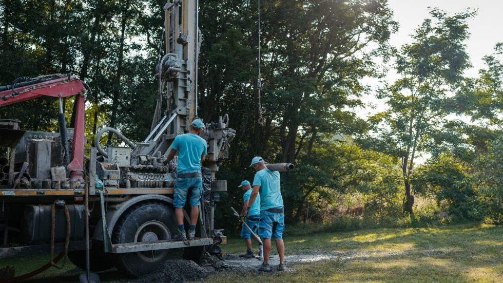 Workers Drilling A Water Well